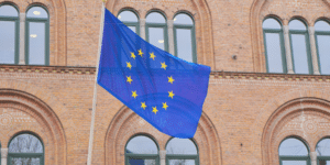 EU- flag in front of brick building.